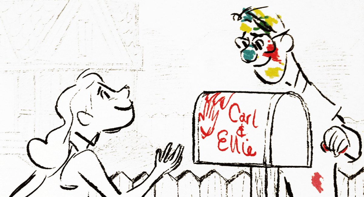 Carl and Ellie stamp their handprints on their mailbox.
