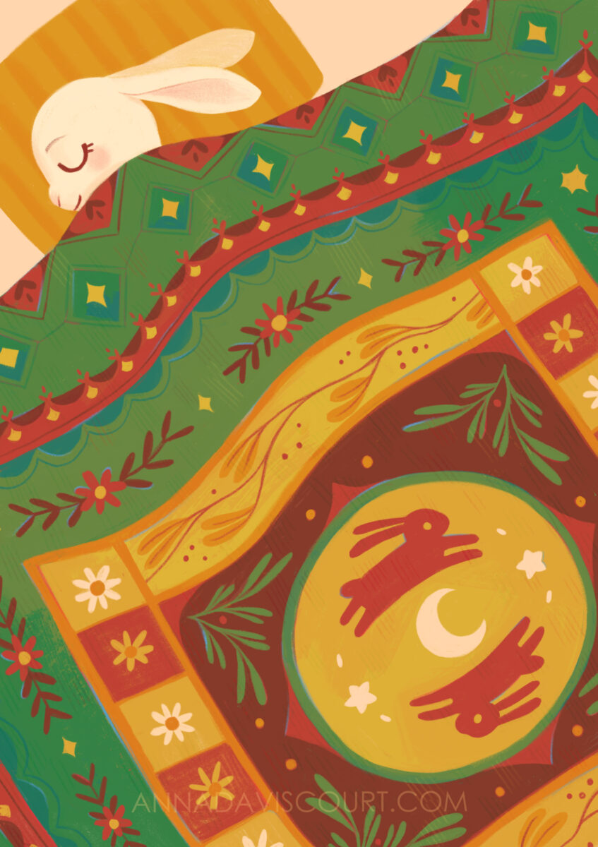 A digital painting of a bunny sleeping under a patterned quilt filled with red, green, and golden details. Watermark: AnnaDaviscourt.com