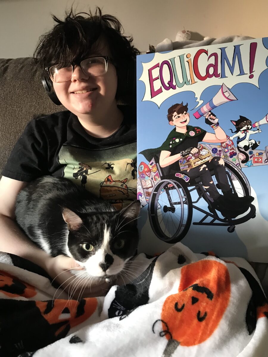 Photo of a child holding a poster of the superhero self they created and was designed by an artist.